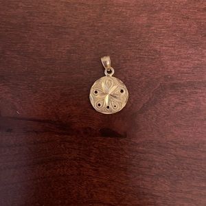 Gold sand dollar pendant